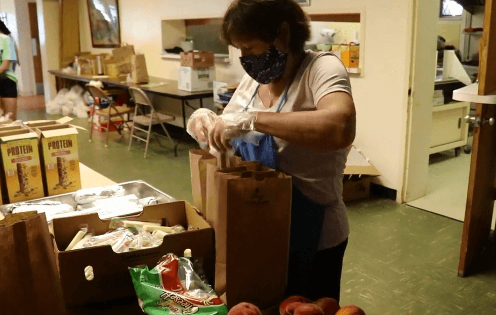Volunteers like Diane Doyle are working to make sure that children have enough to eat this summer.