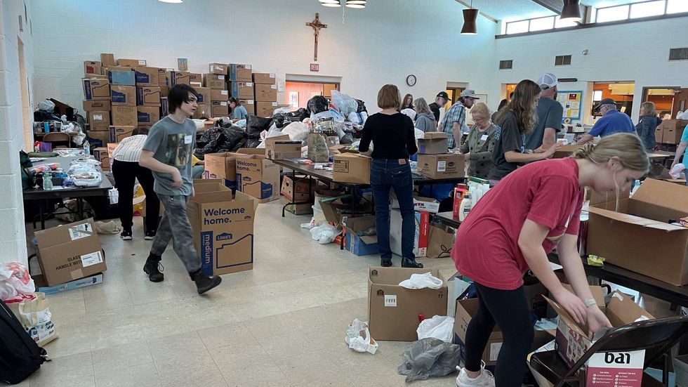 Volunteers packing some of the thousands of boxes of donations for Ukraine dropped off at Presentation of Our Lord Ukrainian Catholic Church in Lansdale and sister parish St. Anne