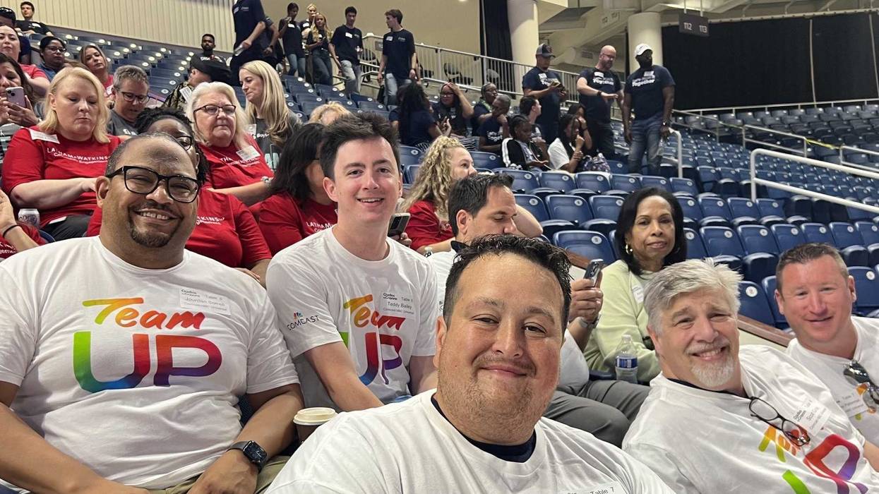 Volunteers pose for a photo at the ninth annual Backpack-A-Thon, hosted by Cradles to Crayons Chicago. Organizers said more than 700 volunteers showed up to pack 35,000 backpacks with school supplies.