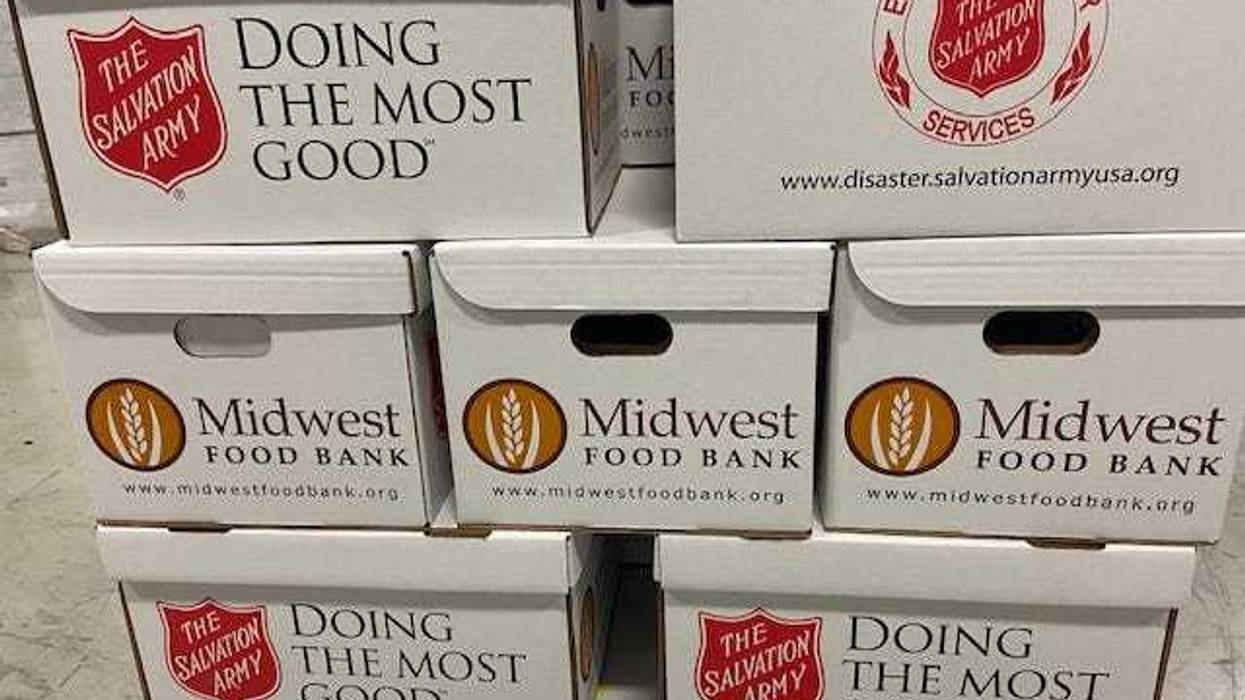 Volunteers were working in a warehouse in the northwest suburbs to pack thousands of boxes of food for needy families this Christmas.