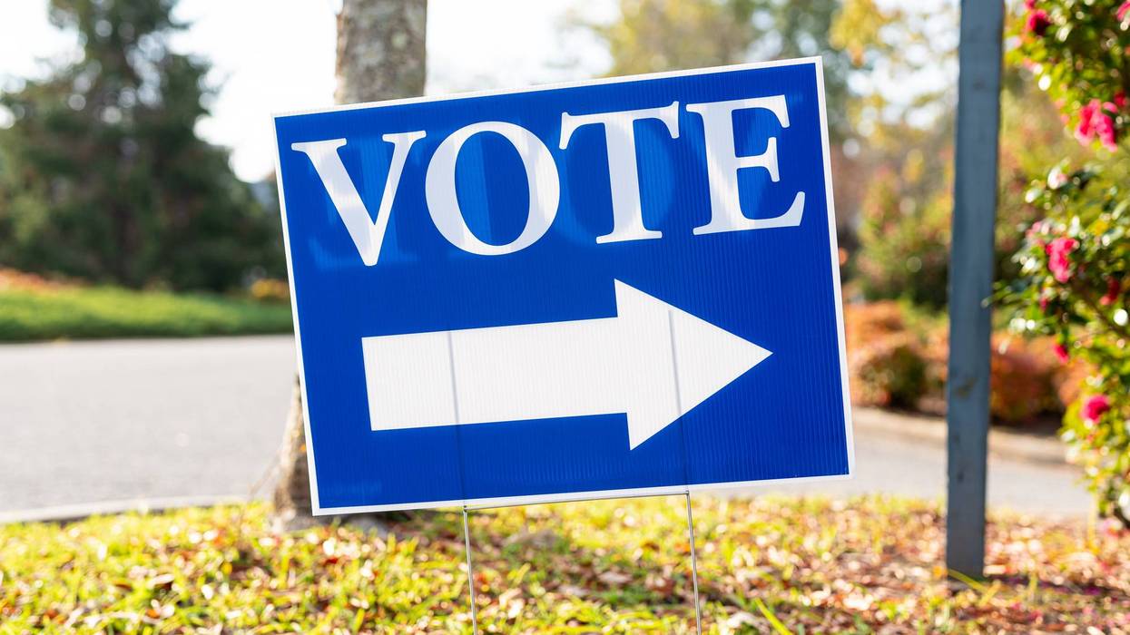 Vote Sign Pointing to Polling Station