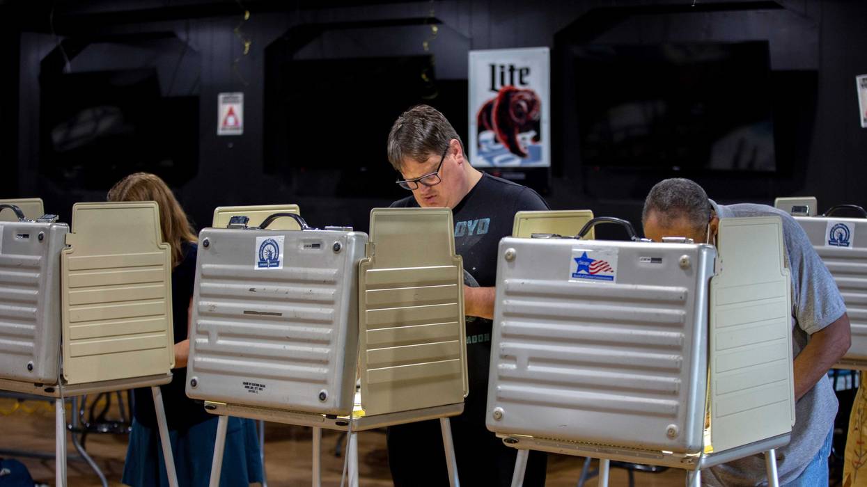 Voters fill out their ballots at a polling place in Chicago.