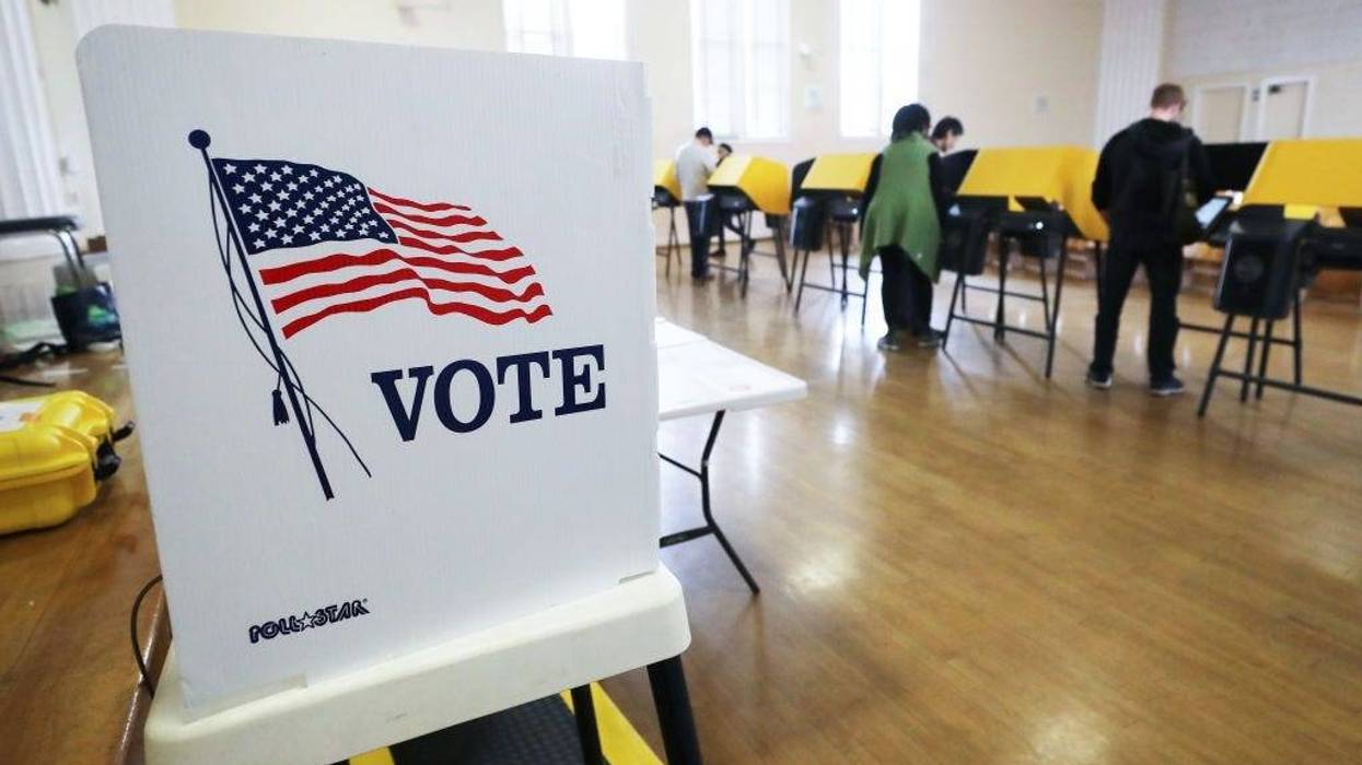 Voters prepare their ballots in voting booths during early voting for the California presidential primary election at an L.A. County 'vote center' on March 1, 2020 in Los Angeles, California.