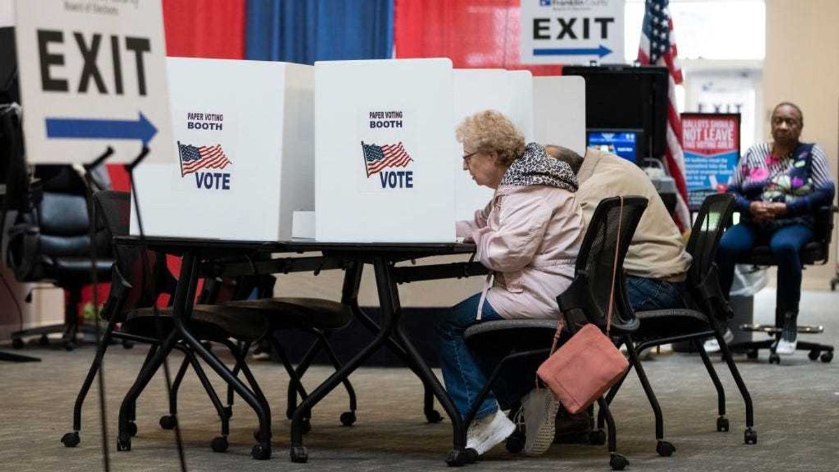 Voters use an optional paper ballot voting booth as they cast their ballots early for the May 3 Primary Election at the Franklin County Board of Elections polling location on April 26, 2022 in Columbus, Ohio.