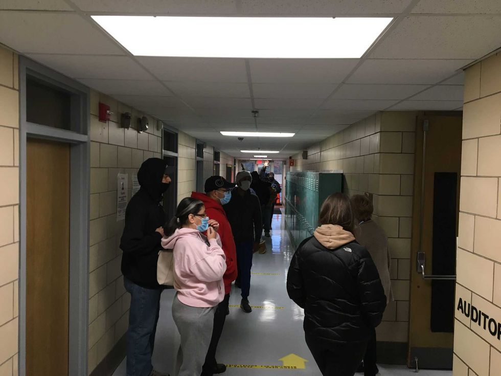 Voters wait in line at JFK Elementary School in Windsor
