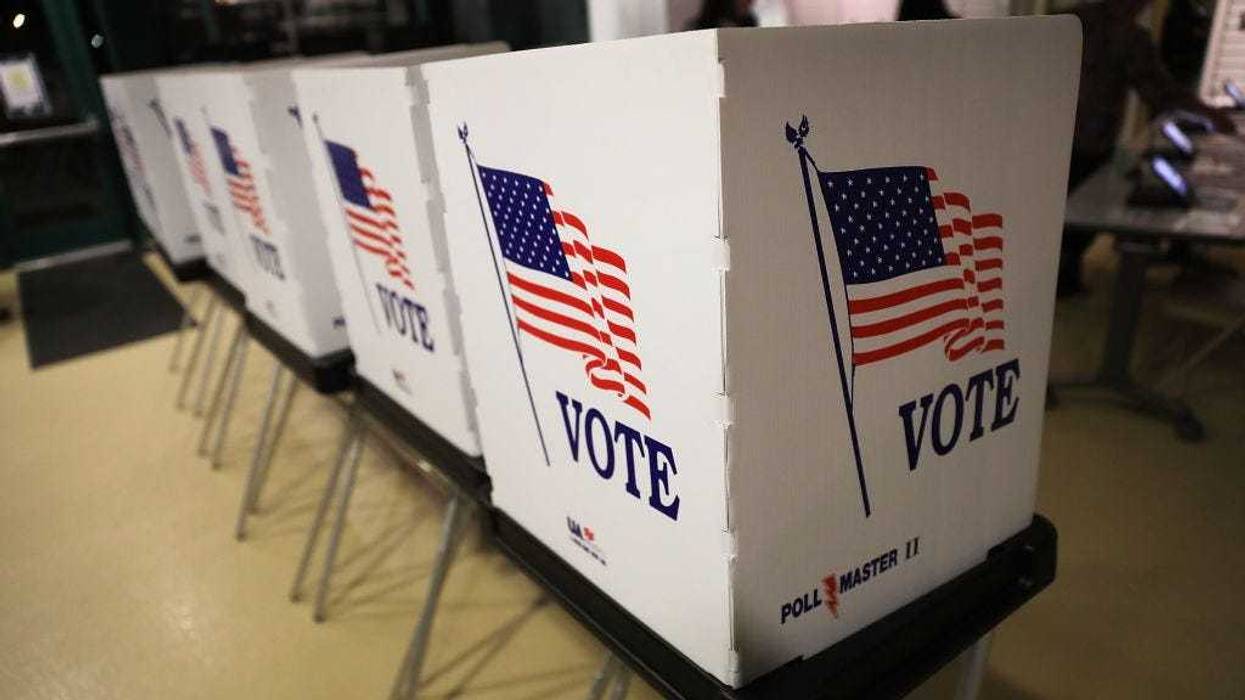 Voting booths are setup at the Yuengling center on the campus of University of South Florida as workers prepare to open the doors to early voters on October 22, 2018 in Tampa, Florida.
