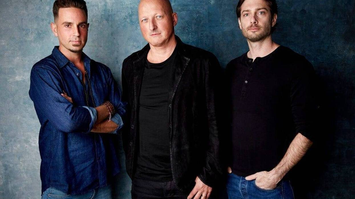 Wade Robson, from left, director Dan Reed and James Safechuck pose for a portrait to promote the film "Leaving Neverland"