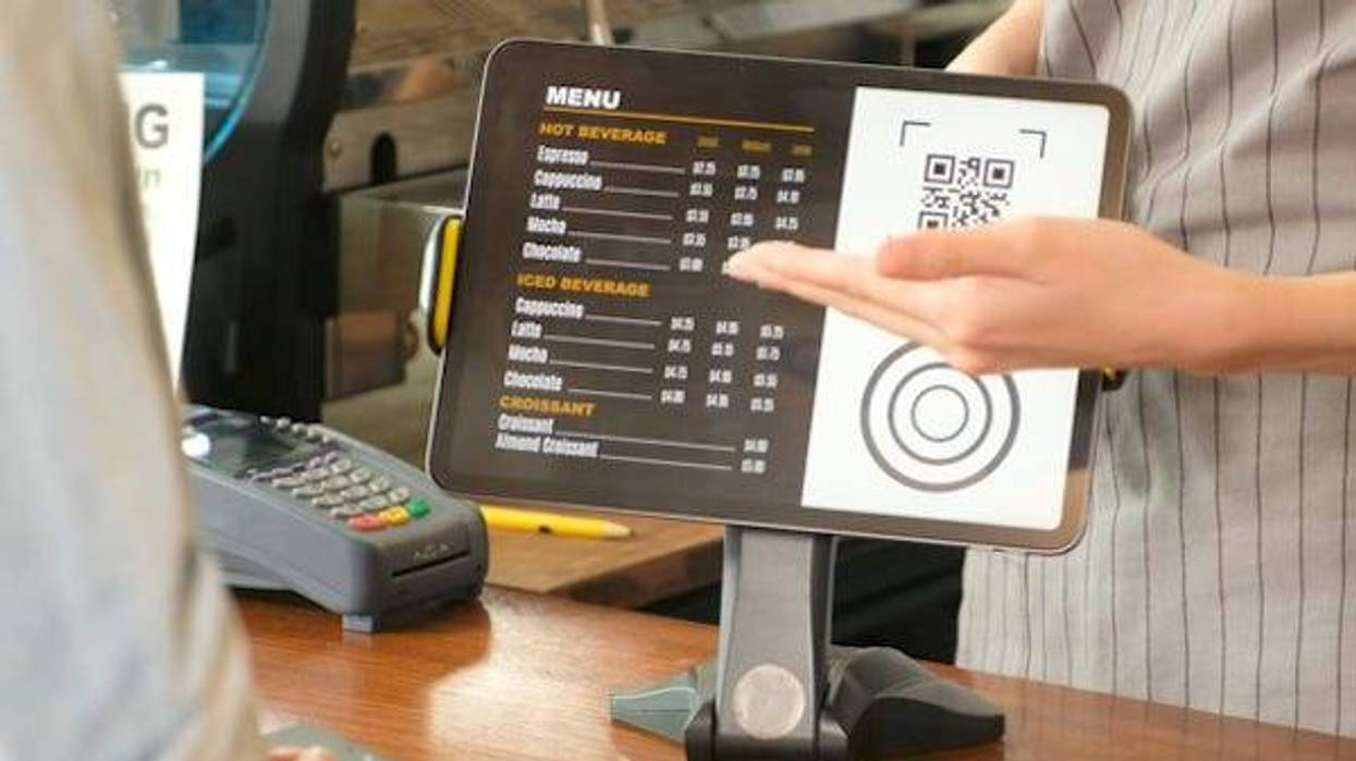 Waitress showing menu on iPad