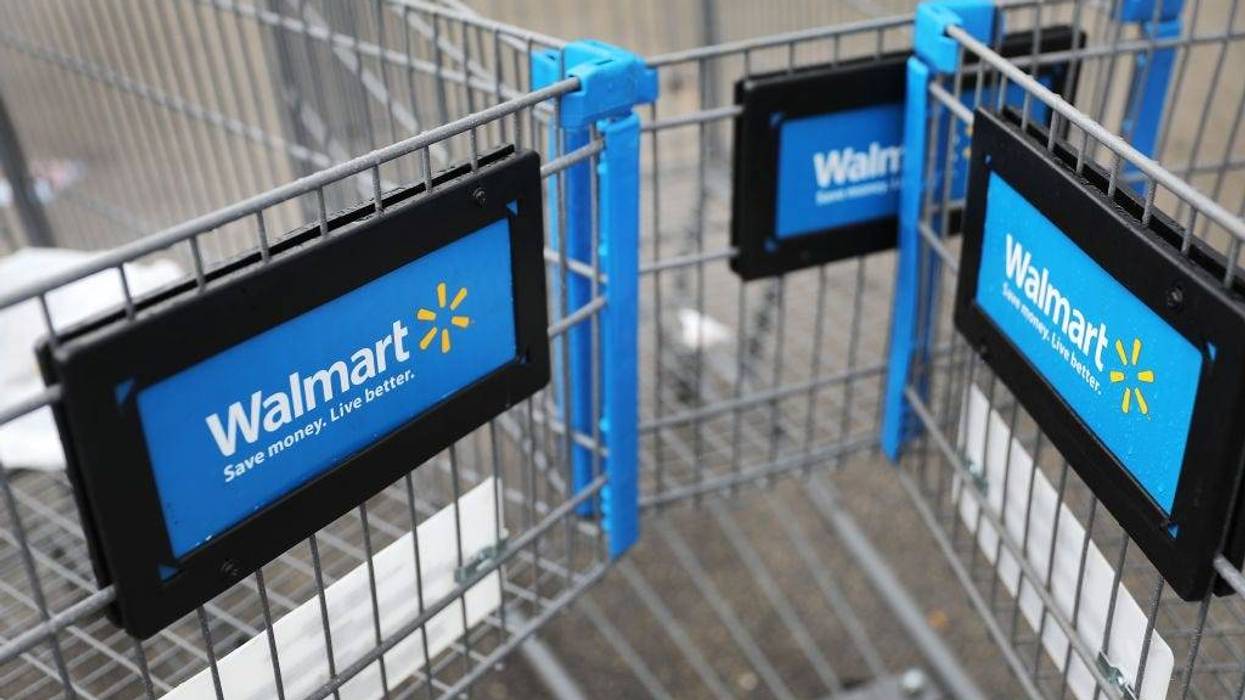 Walmart carts are seen outside of a store