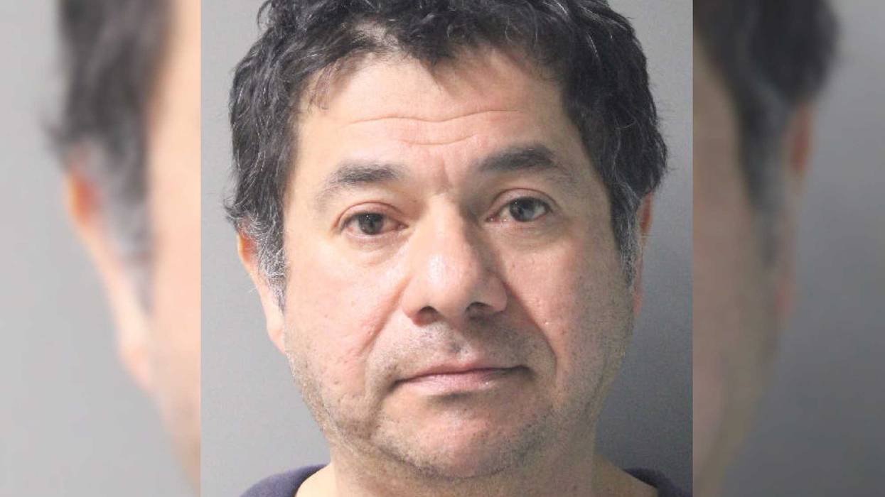 Walter Rivas, 45, was arrested and charged with unlawful surveillance.