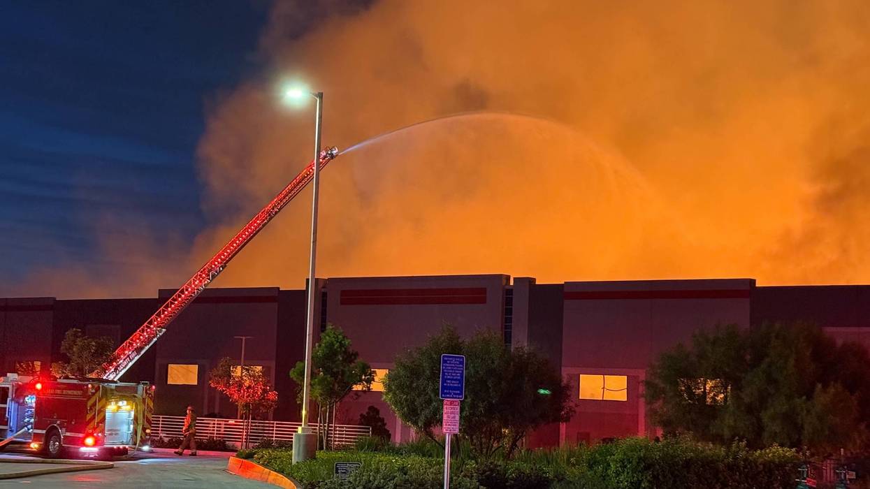 Suspect in custody in massive warehouse fire in Ontario