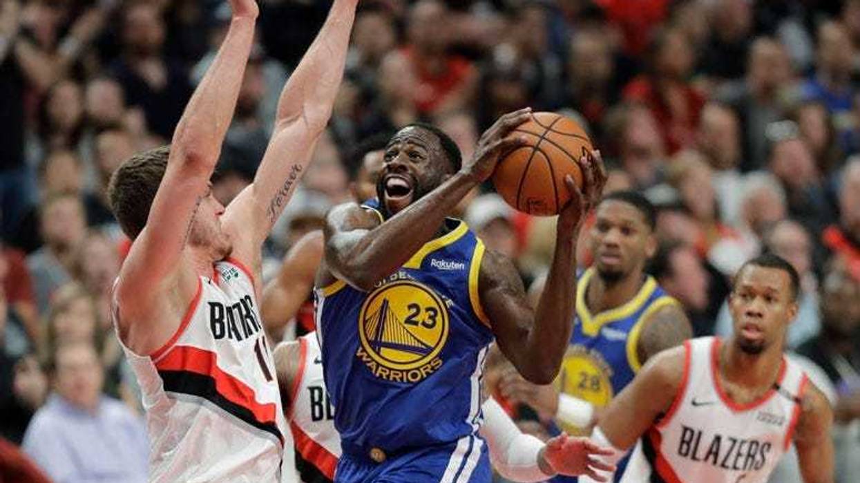 Warriors guard Stephen Curry celebrates with teammates during the fourth quarter against the Cleveland Cavaliers in Game 3 of the NBA Finals on June 6, 2018, at Quicken Loans Arena.