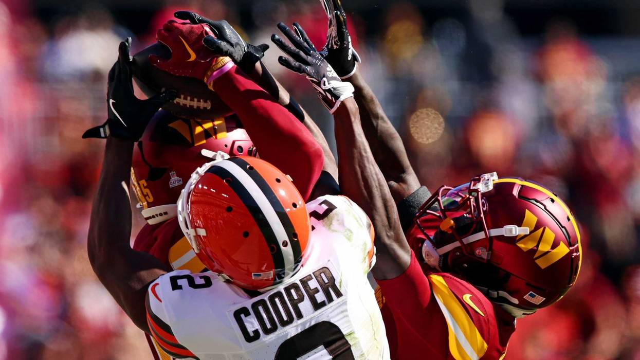 Washington Commanders cornerback Benjamin St-Juste (25) breaks up a pass intended for Cleveland Browns wide receiver Amari Cooper (2) during the second quarter at NorthWest Stadium.