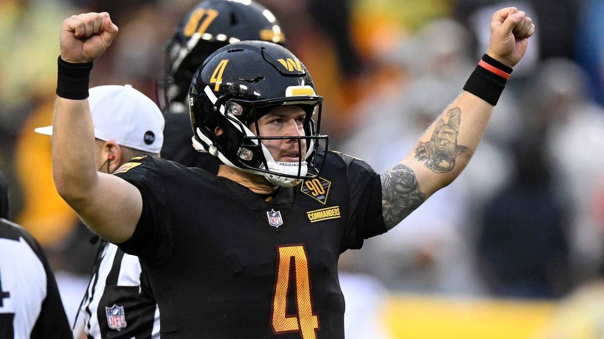 Washington Commanders quarterback Taylor Heinicke celebrates during a game in the 2022-23 NFL season.
