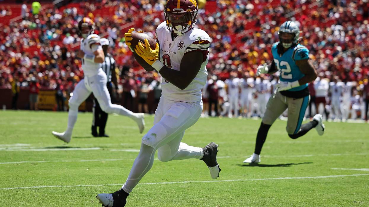 Washington Commanders running back Brian Robinson Jr. hauls in a pass during the team's first 2022 preseason game against the Carolina Panthers.