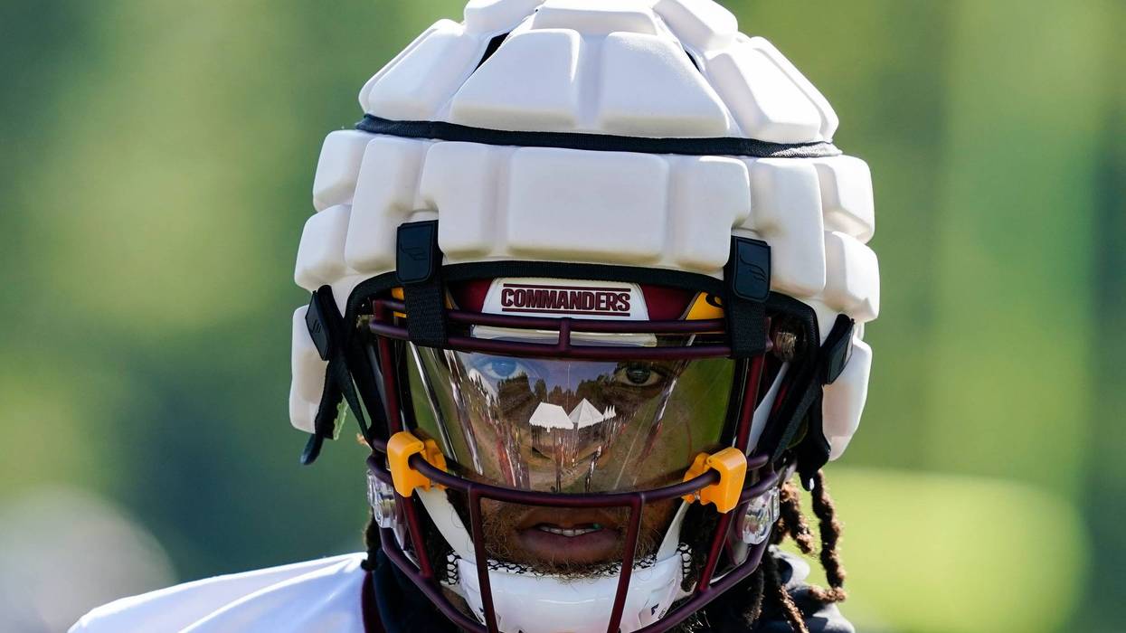 Washington Commanders running back Jonathan Williams wears a Guardian Cap football helmet during practice at the team's NFL football training facility, Wednesday, July 27, 2022 in Ashburn, Va.
