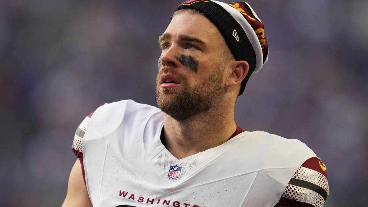 Washington Commanders tight end Zach Ertz stands on the field during the first half of an NFL football game against the Minnesota Vikings, Dec. 7, 2025, in Minneapolis.