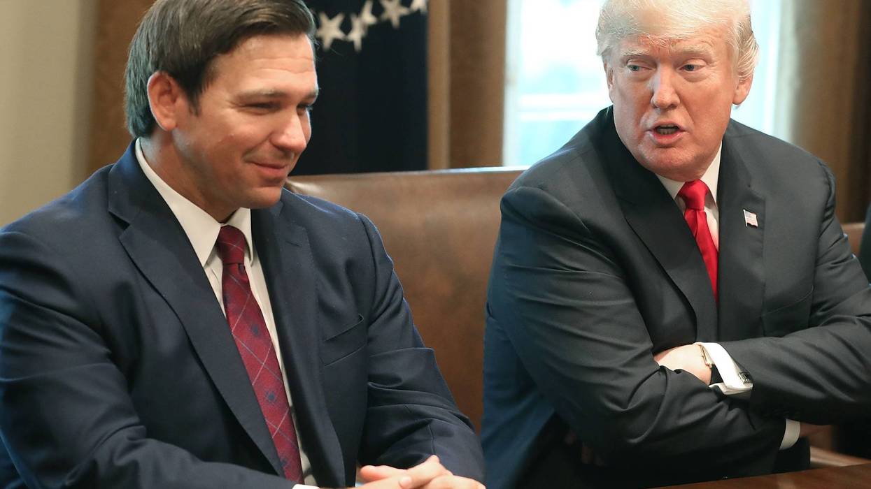 WASHINGTON, DC - DECEMBER 13: Florida Governor-elect Ron DeSantis (R) sits next to U.S. President Donald Trump during a meeting with Governors elects in the Cabinet Room at the White House on December 13, 2018 in Washington, DC.