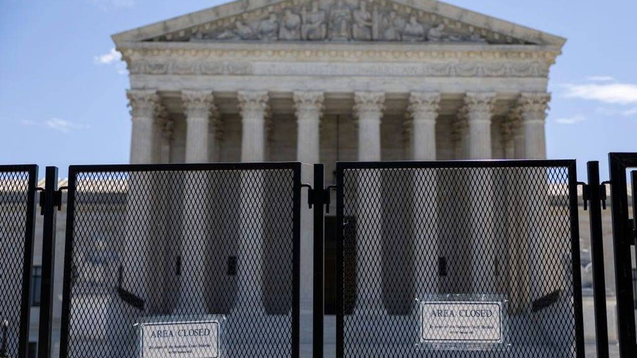 WASHINGTON, DC - JUNE 20: Temporary security fencing surrounds the U.S. Supreme Court Building on June 20, 2022 in Washington, DC. This week the court will release more opinions for cases including decisions on abortion rights, guns, religion and climate change.
