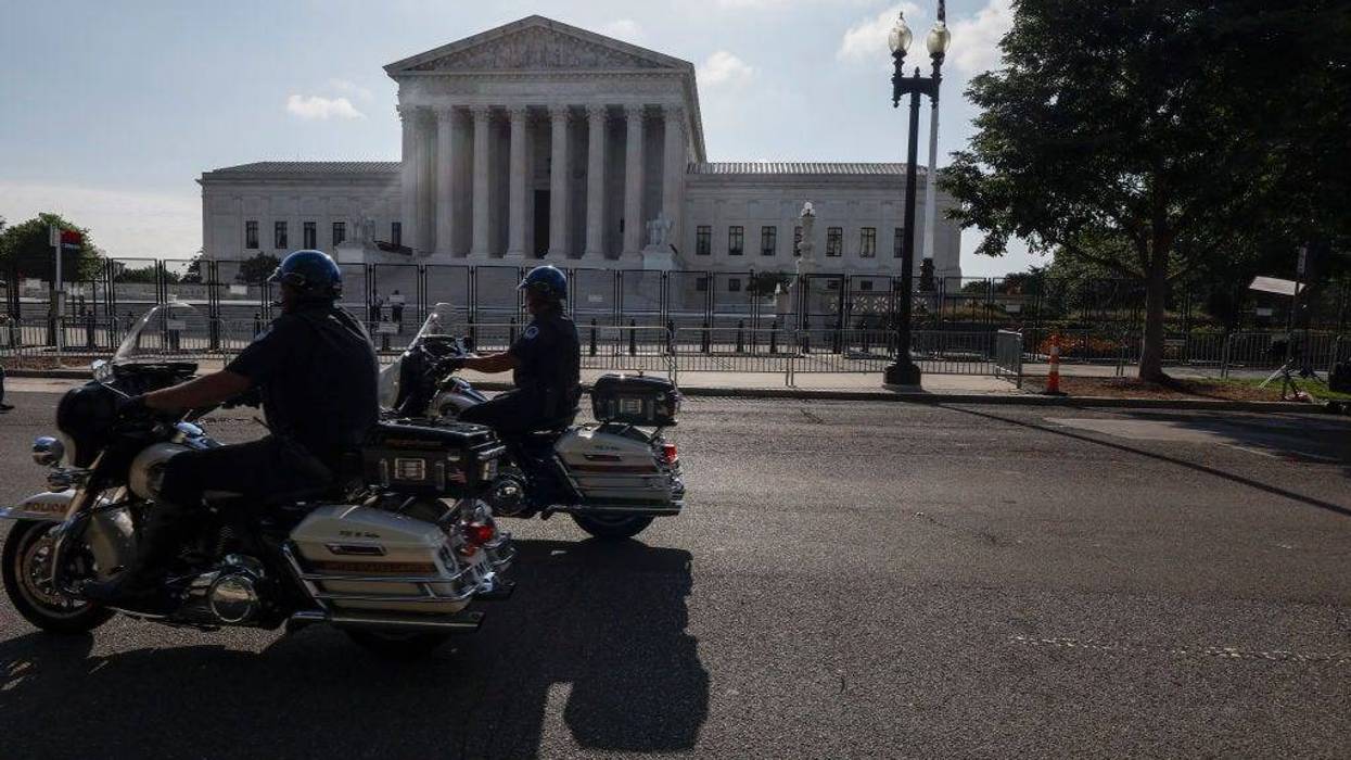 WASHINGTON, DC - JUNE 23: U.S. Capitol Police Officers drive past the U.S. Supreme Court Building on June 23, 2022 in Washington, DC. Decisions are expected in nine more cases before the end of the Court's current session, with some activists waiting on a highly-anticipated ruling on the potential overturning of Roe vs Wade.