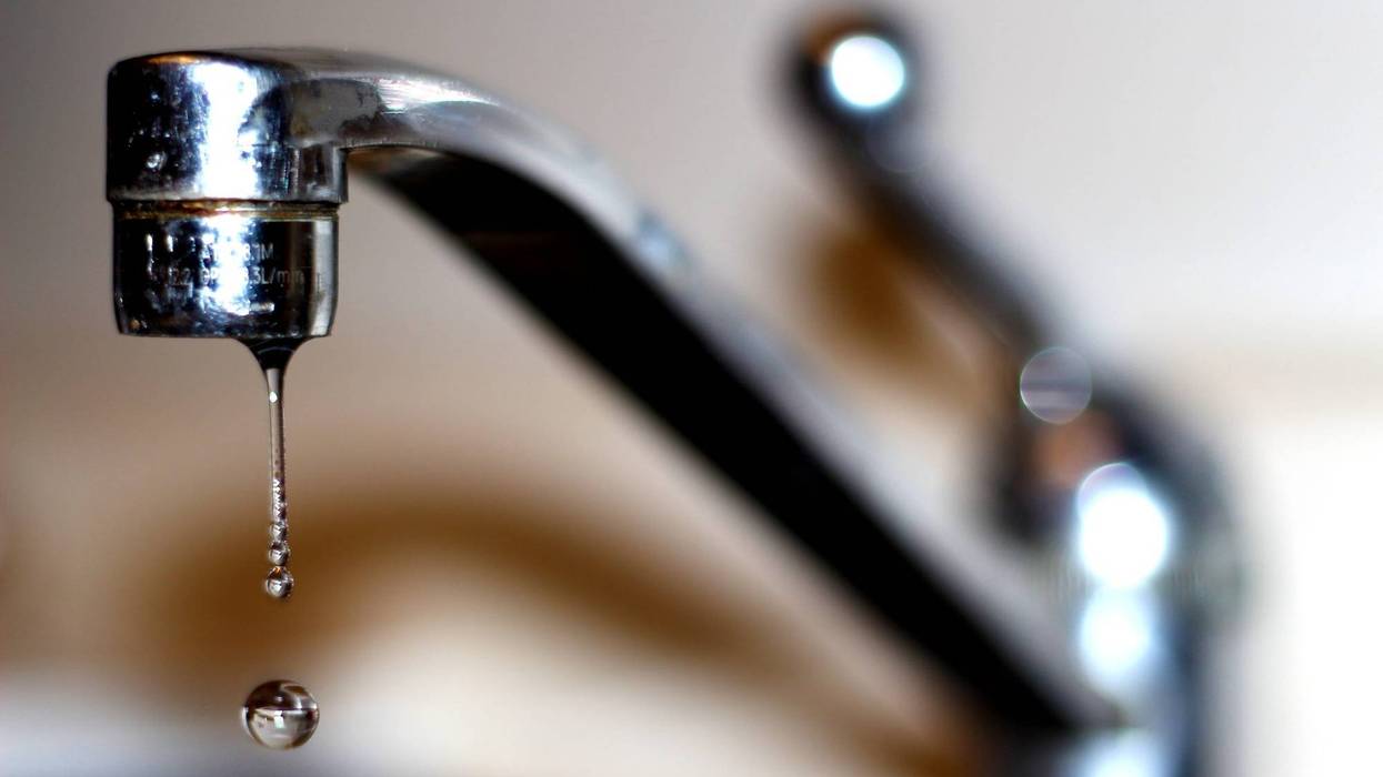 Water coming from faucet in sink
