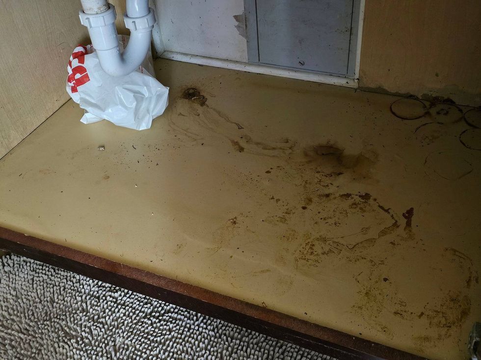 Water damage underneath a sink inside of a residence at the Chicago Housing Authority-operated Washington Park Homes. Residents said they