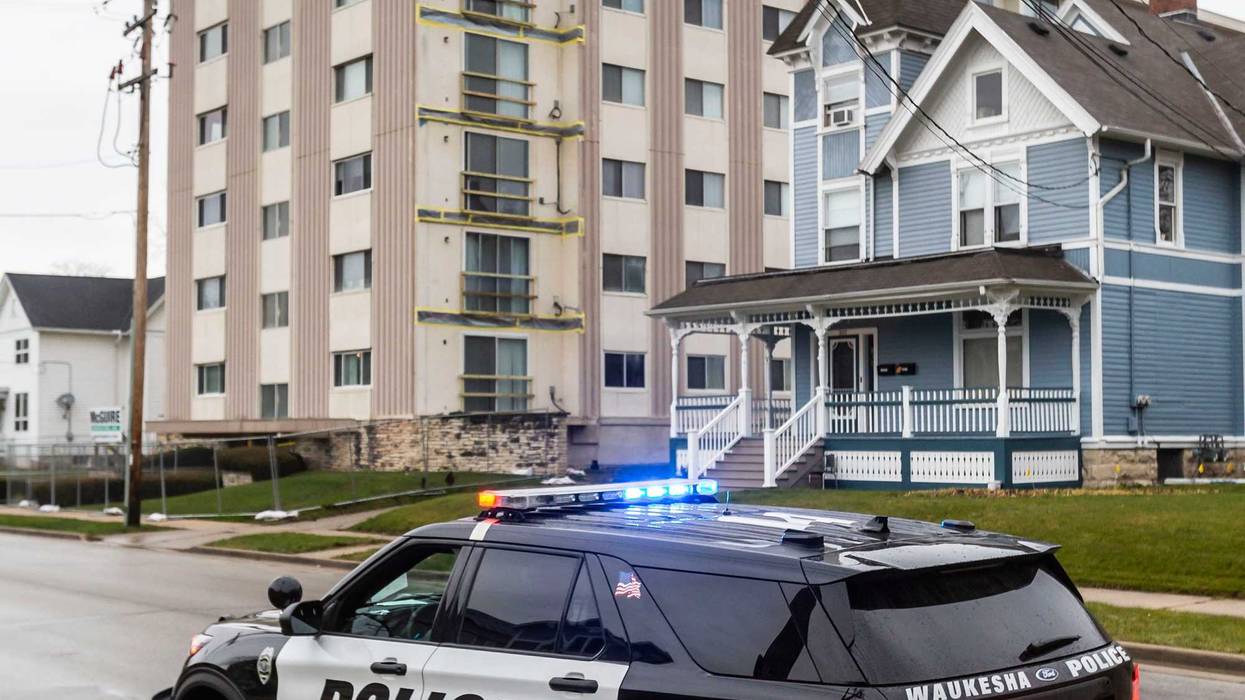 Waukesha police watch over the vacant Horizon West Condominium Building at 315 N. West Ave. on Friday morning, Dec. 3, 2021. The Waukesha Fire Department ordered the evacuation of the 48-unit building on Thursday night, saying the building posed an imminent threat of collapsing.