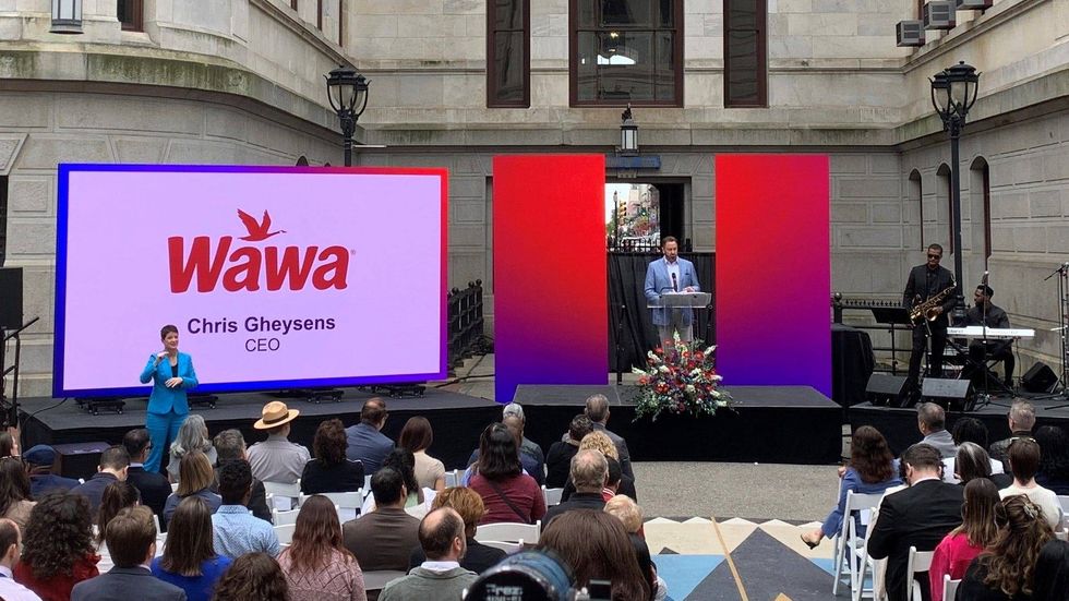 Wawa President and CEO Chris Gheysens addresses an audience at City Hall during the unveiling ceremony for the 2024 Welcome America festival.