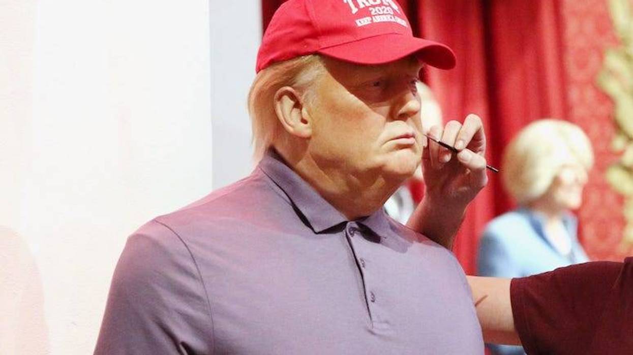 Wax figure of Donald Trump getting touched up