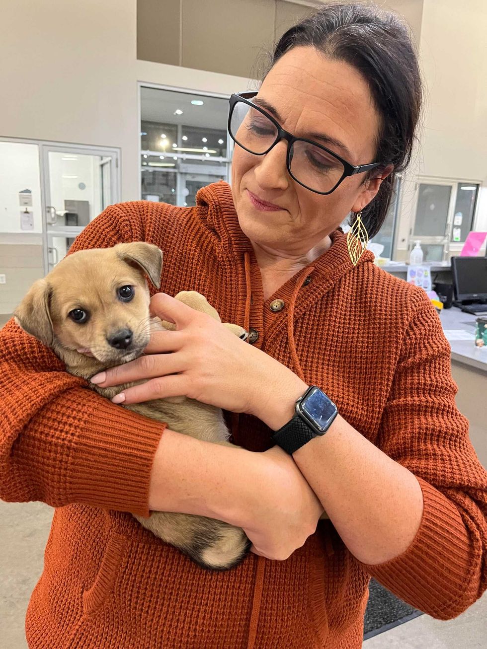 WBEN Brand Manager Lisa Polizzi and a puppy up for adoption at the SPCA Serving Erie County