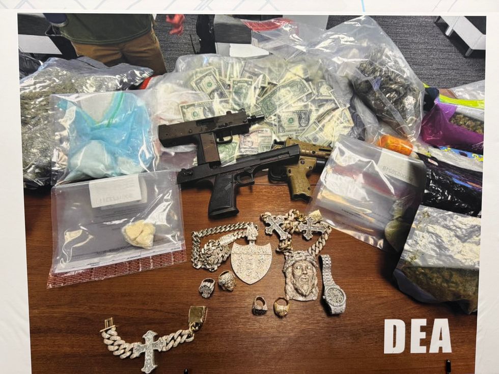 Weapons, money, and drugs seized