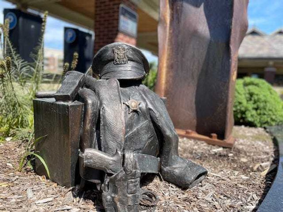 Wedged between 95th Street and Museum Drive and behind the Metra Station, an installation that incorporates four, 22-foot beams of World Trade Center Steel.