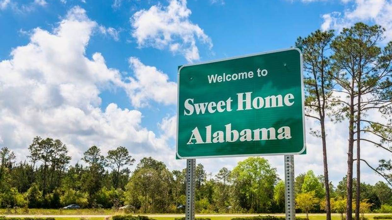 Welcome to Sweet Home Alabama Road Sign along Interstate 10 in Robertsdale, Alabama USA, near the State Border with Florida.
