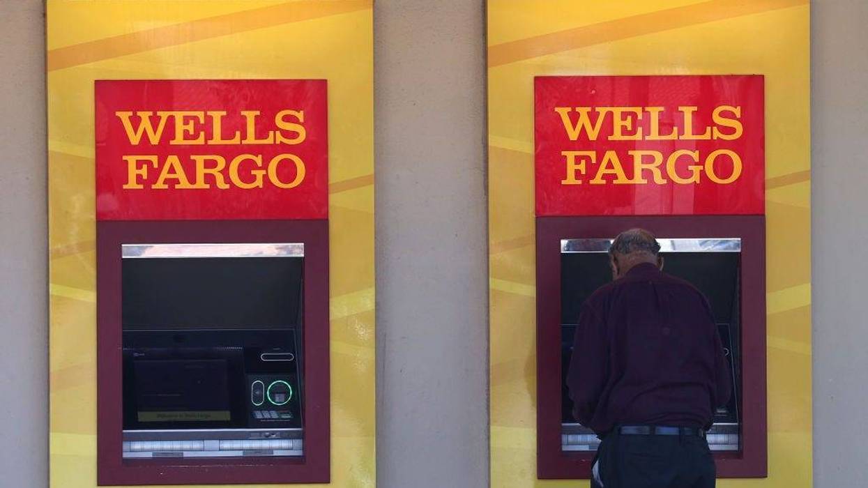 Wells Fargo customers use the ATM at a bank branch on August 08, 2023 in San Bruno, California.