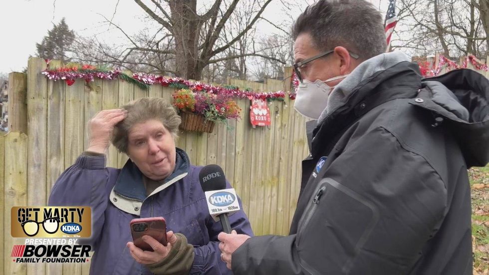 Wendi Kraemer show burned hair while talking to Marty Griffin outside Angels Journey Home Animal Rescue.