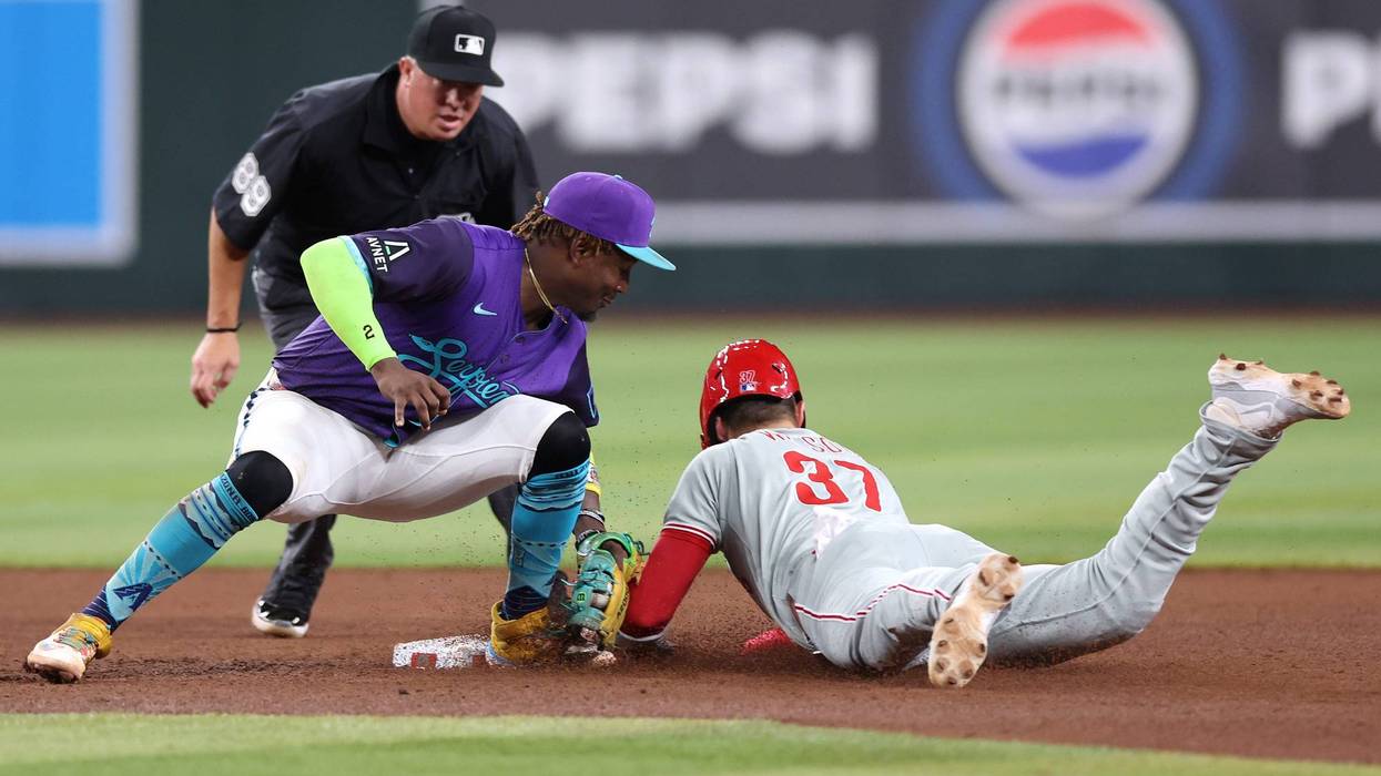 Weston Wilson #37 of the Philadelphia Phillies is tagged out attempting to steal second base by Geraldo Perdomo #2 of the Arizona Diamondbacks during the sixth inning at Chase Field on September 19, 2025