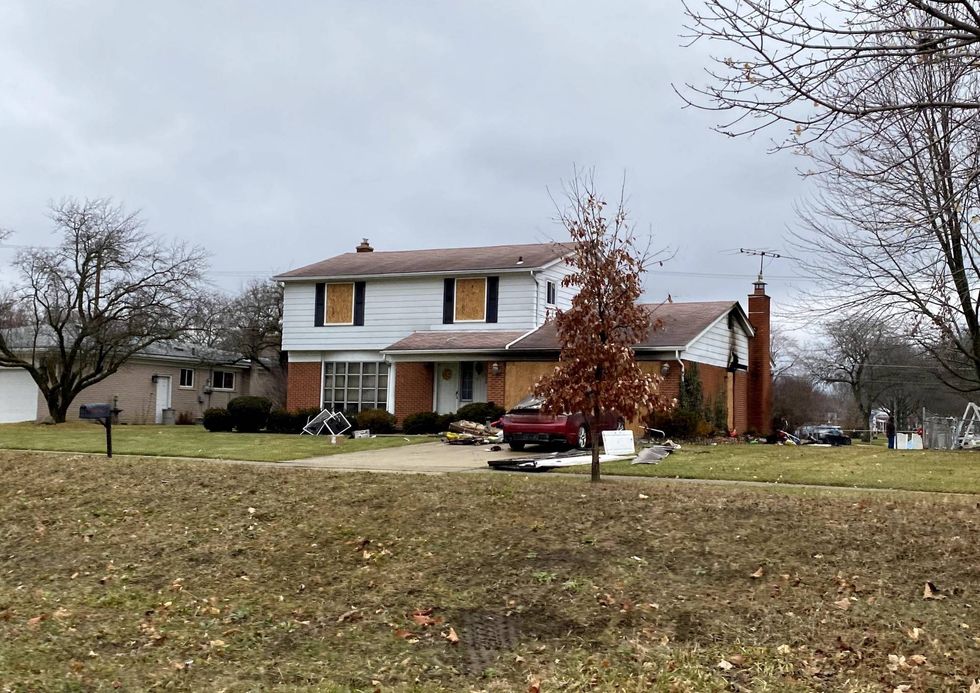 What remains of a Livonia home after a raging fire broke out Friday night and killed its sole resident