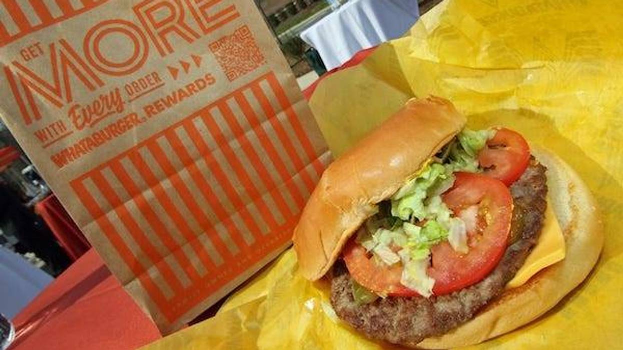 Whataburger with cheese, tomatoes, pickles, and onions