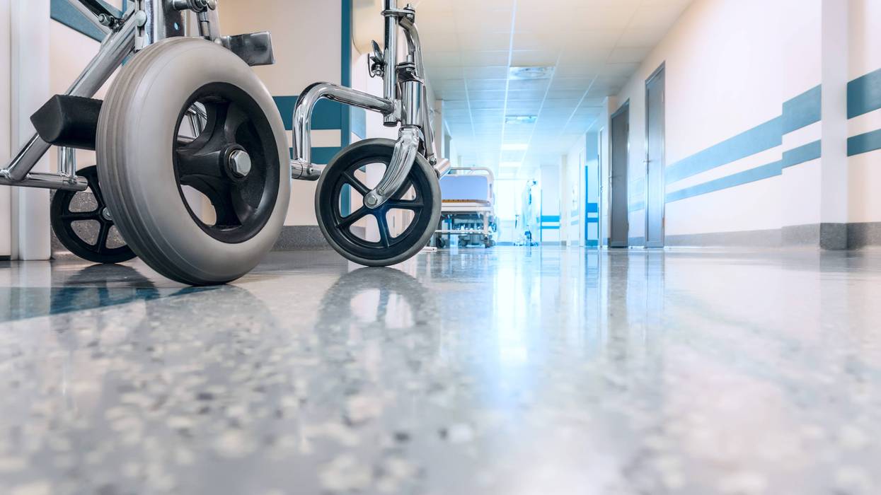 Wheelchair shown in hospital hallway