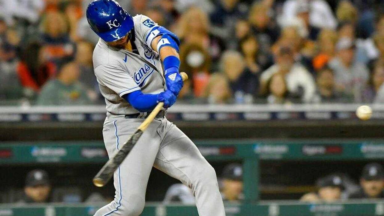 Whit Merrifield hits a sacrifice fly, scoring Kyle Isbel, in the eighth inning