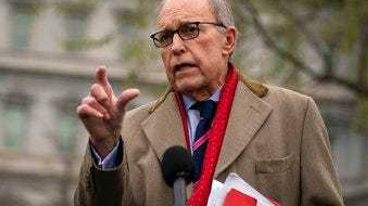 White House chief economic adviser Larry Kudlow talks with reporters about economic impacts of the coronavirus, at the White House, Tuesday, March 24, 2020, in Washington. (AP Photo/Evan Vucci)