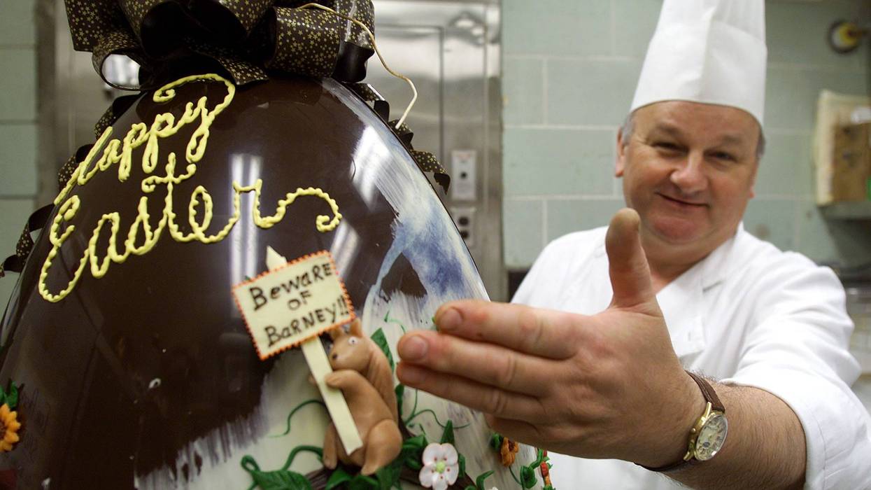 White House Pastry Chef Roland Mesnier puts the finishing touches on a 50 pound chocolate Easter egg for the annual White House Easter Egg Roll April 13, 2001 in Washington, D,C.