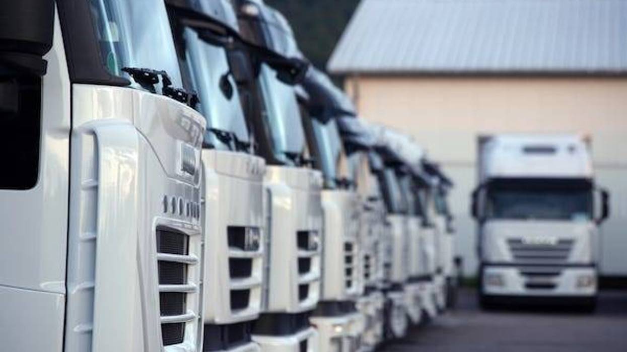 White trucks parked in a parking lot