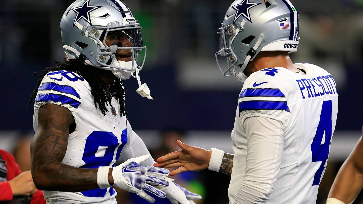 Wide receiver CeeDee Lamb #88 of the Dallas Cowboys is congratulated by quarterback Dak Prescott #4 after catching a pass in the end zone for a touchdown during the 1st quarter of the game against the Seattle Seahawks at AT&T Stadium on Nov. 30, 2023, in Arlington, Texas.
