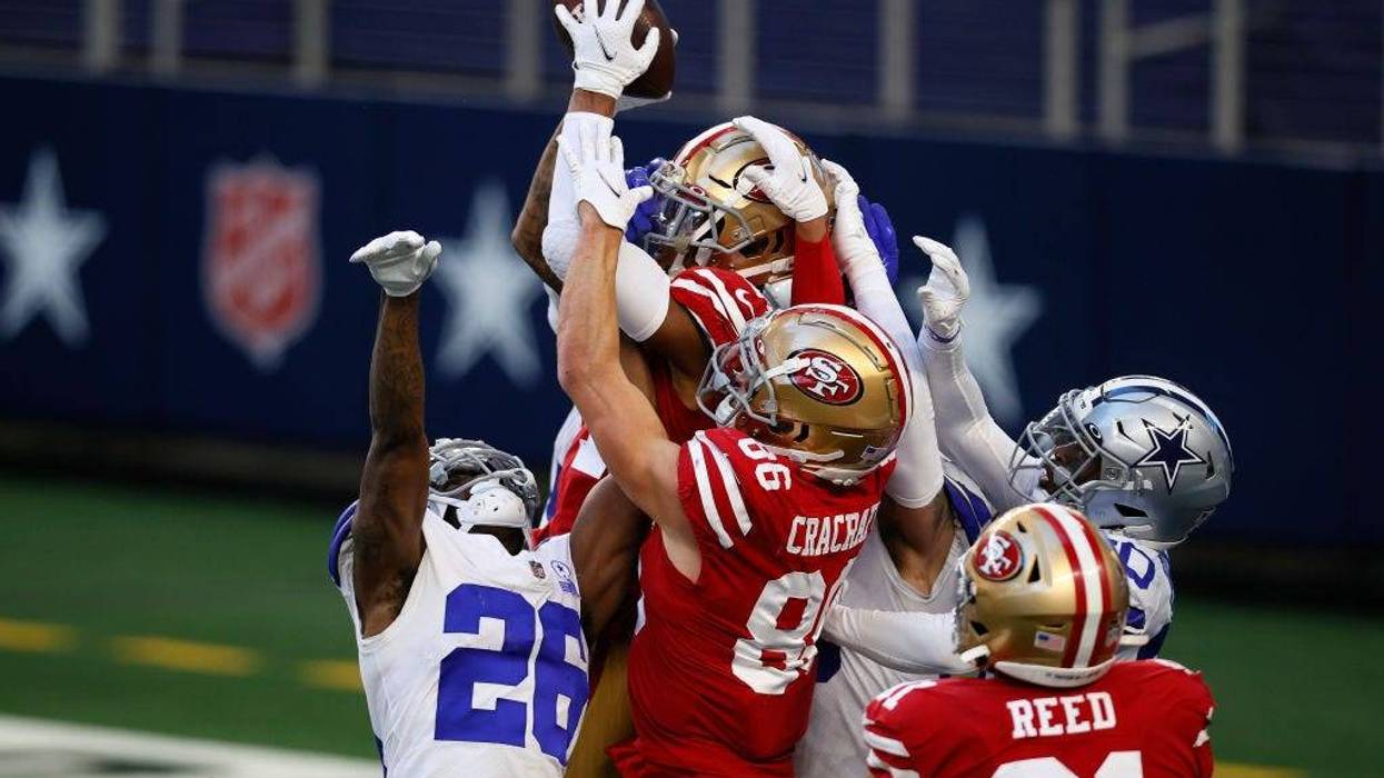 Wide receiver Kendrick Bourne #84 of the San Francisco 49ers pulls in a hail Mary touchdown pass at the end of the game against cornerback Jourdan Lewis #26 of the Dallas Cowboys at AT&T Stadium on December 20, 2020 in Arlington, Texas.