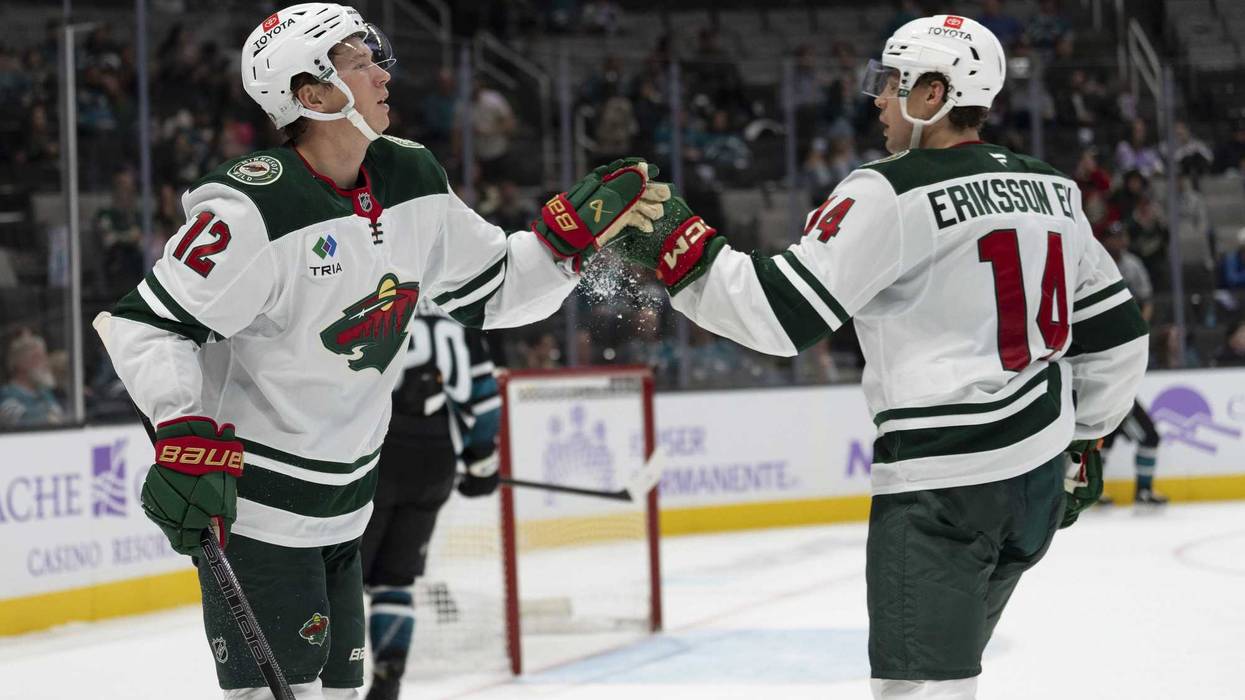 Wild left wing Matt Boldy (12) celebrates with center Joel Eriksson Ek (14) during the third period against the San Jose Sharks at SAP Center at San Jose.