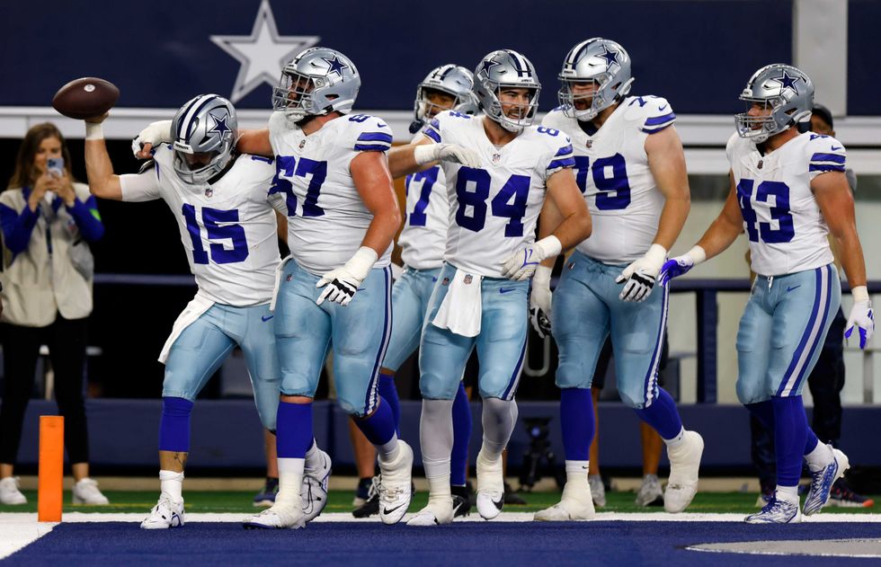 Will Grier celebrates touchdown with Cowboys teammates