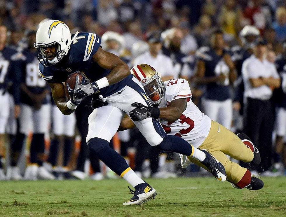 Will Redmond #23 of the San Francisco 49ers tackles Dom Williams #7 of the San Diego Chargers during a preseason game at Qualcomm Stadium on September 1, 2016 in San Diego, California.