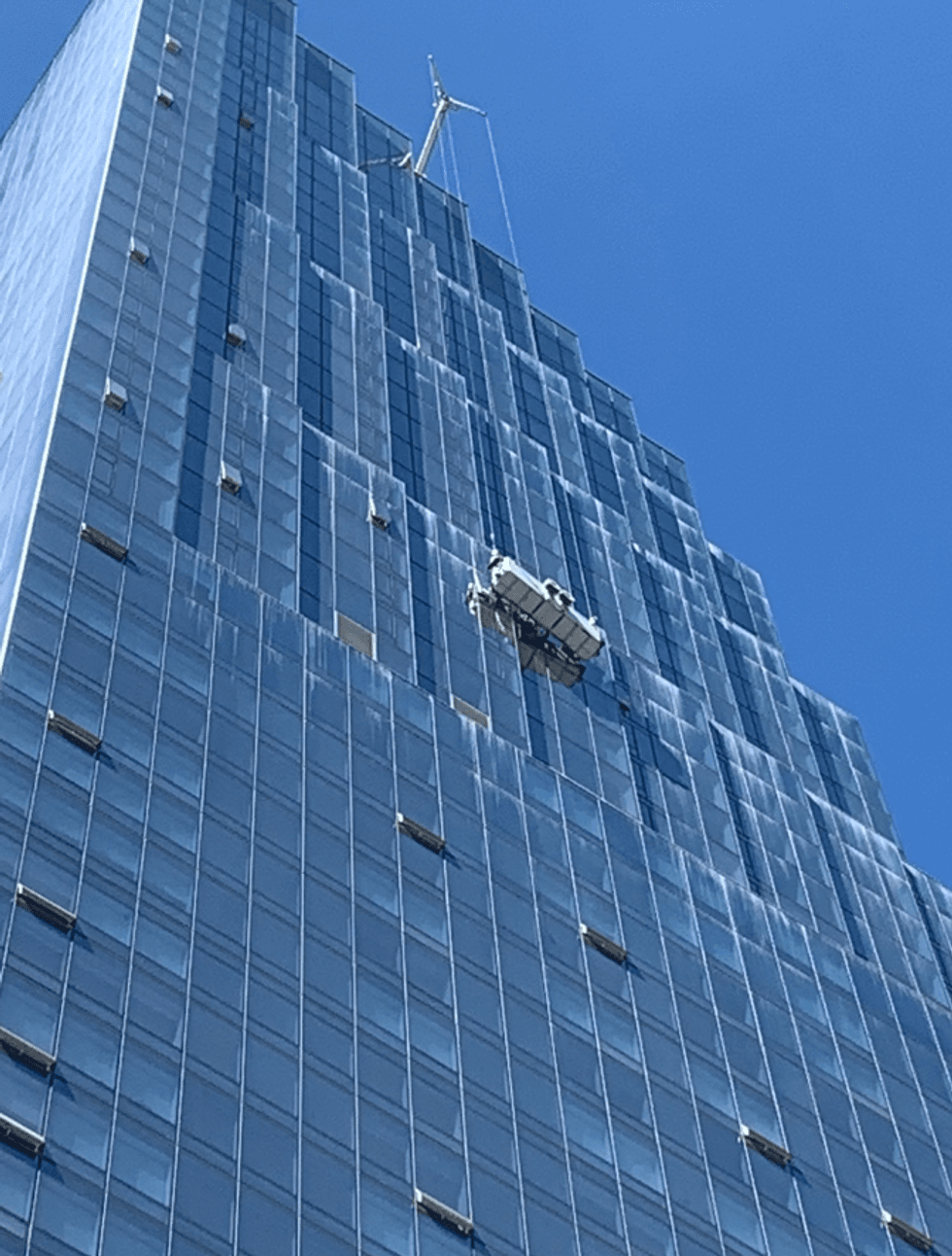 Window washers suspended at 450 Folsom St. in San Francisco.