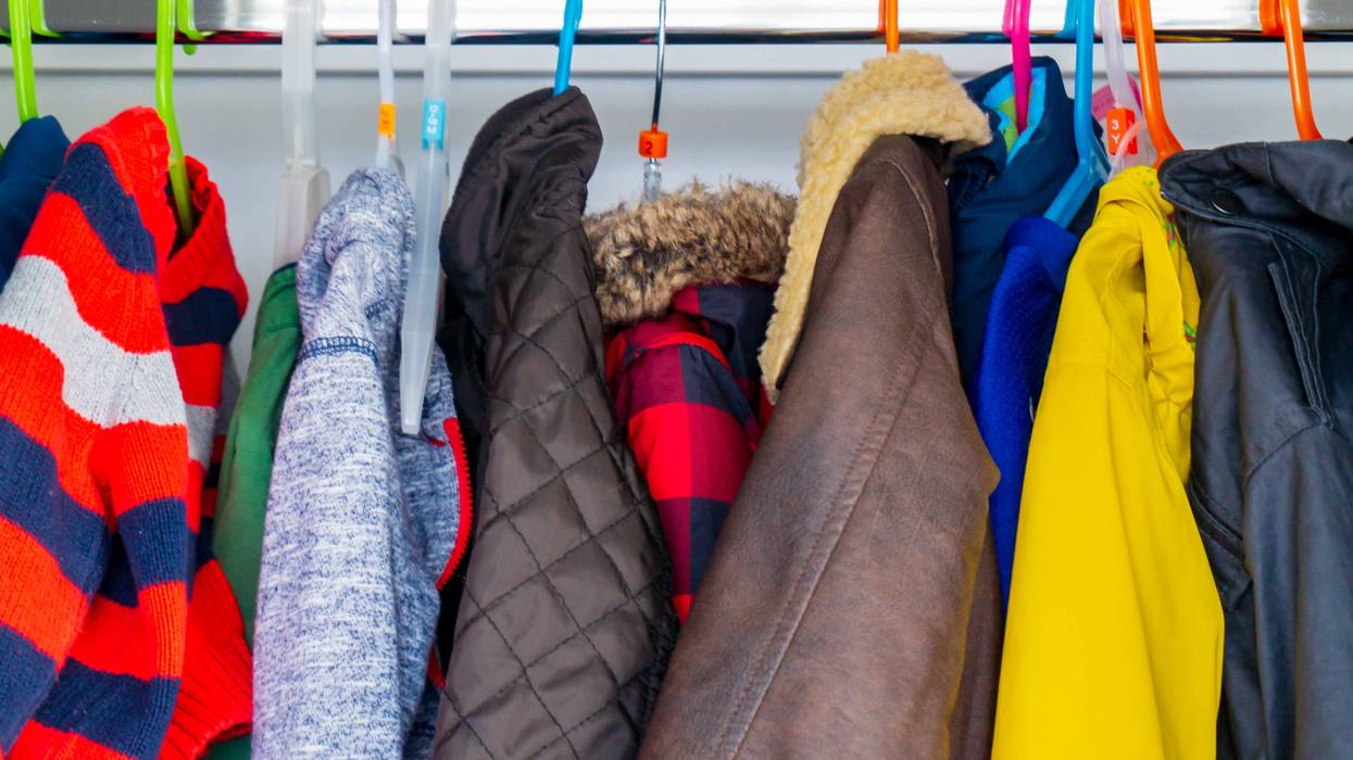 winter coats hanging on clothing rack